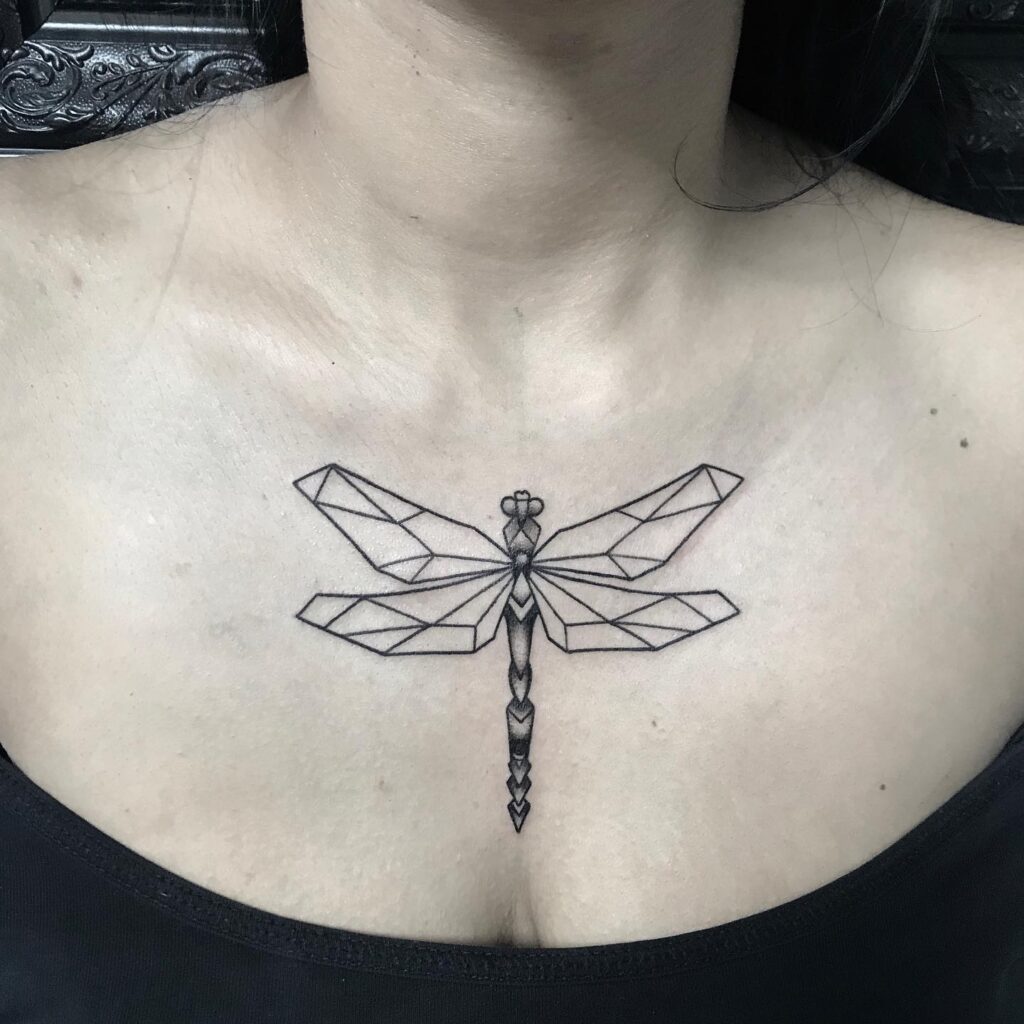 Geometric Dragonfly Tattoo on Sternum Modern and Stylish Tattoo Idea