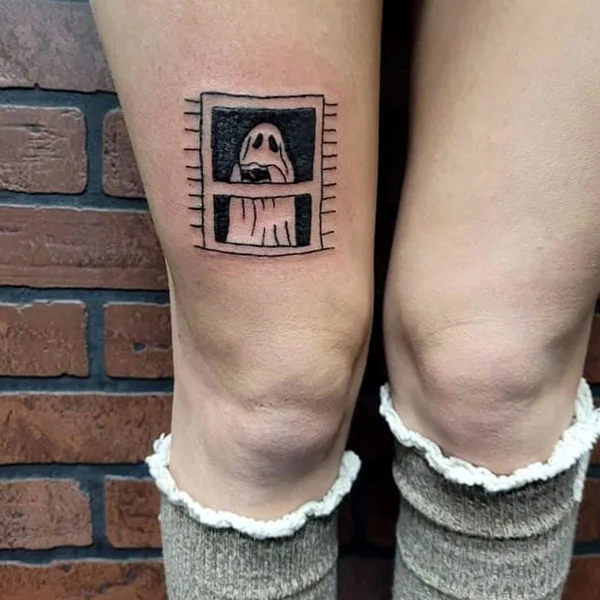 Ghost above knee tattoo