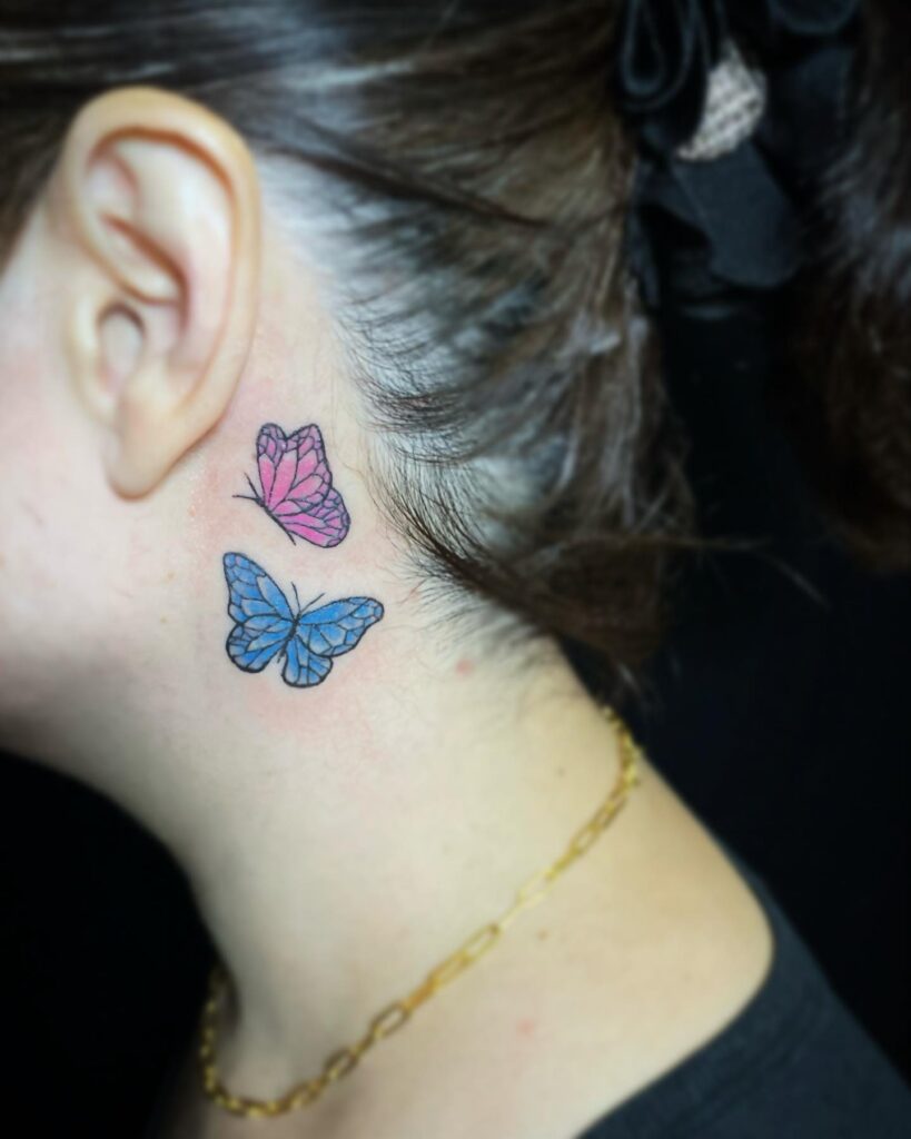 Girls with with 2 colorful tattoo female behind the ear expressive art