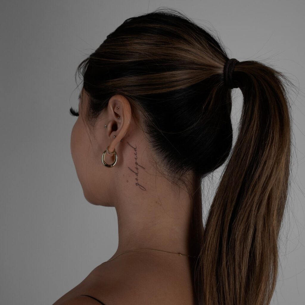 Godspeed Cursive Neck Tattoo Elegant and Meaningful Fine-Line Design