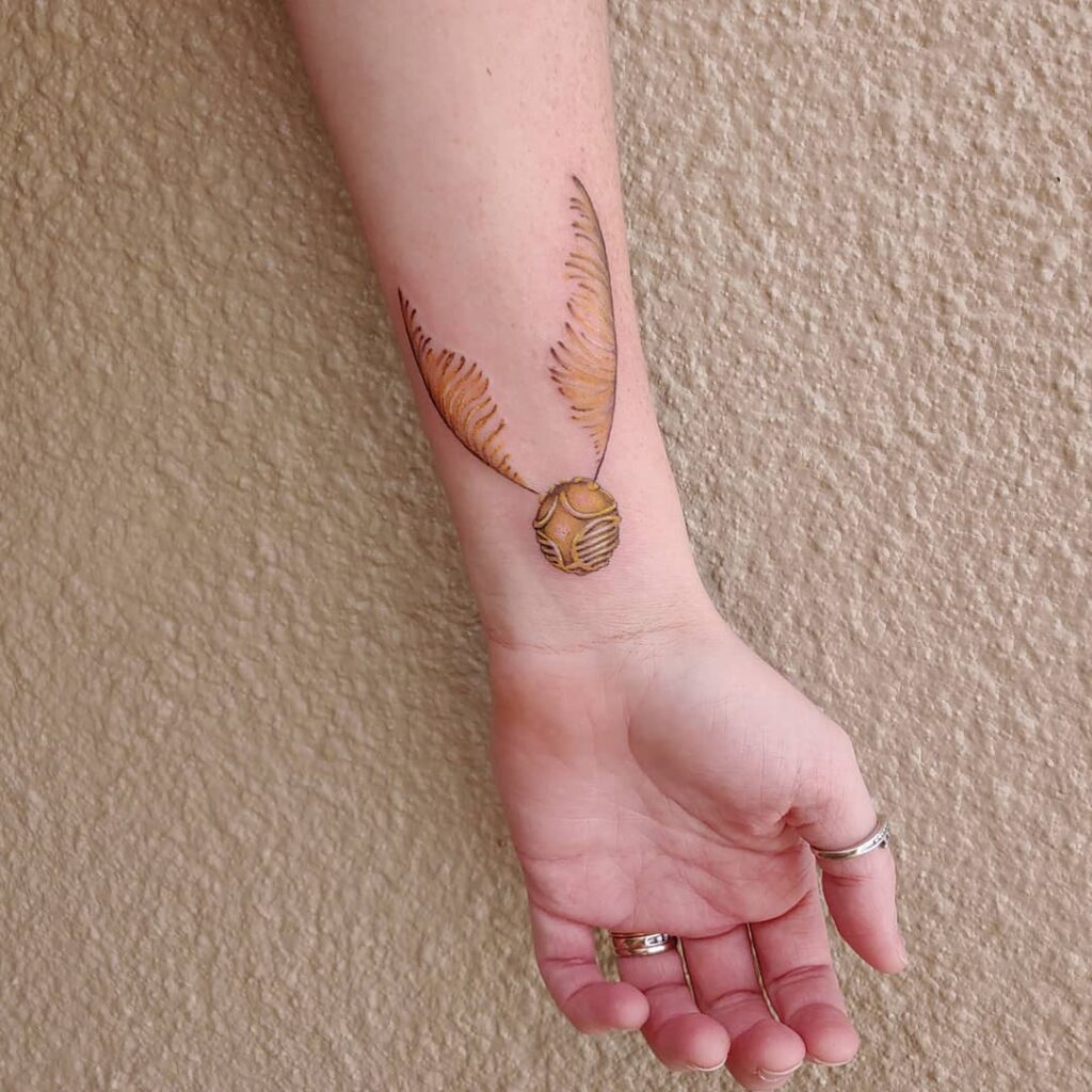 Golden Elegance Forearm Snitch Tattoo