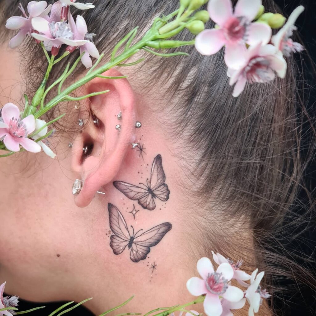 Gorgeous pair with celestial touch two flying butterflies adorned with stars behind the ear