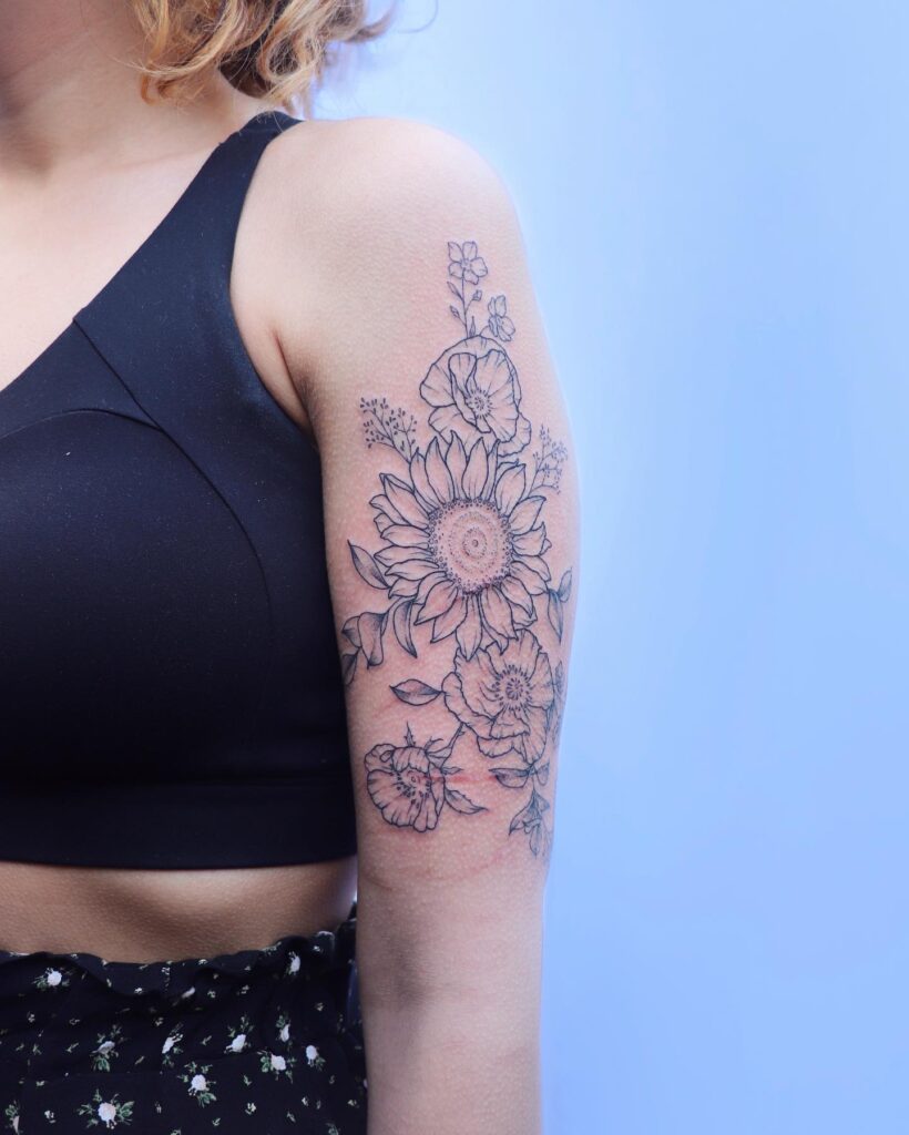 Gorgeous sunflower half sleeve tattoo: vibrant blooms in full bloom