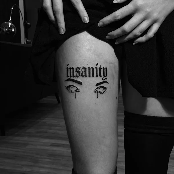 Gothic lettering tattoo