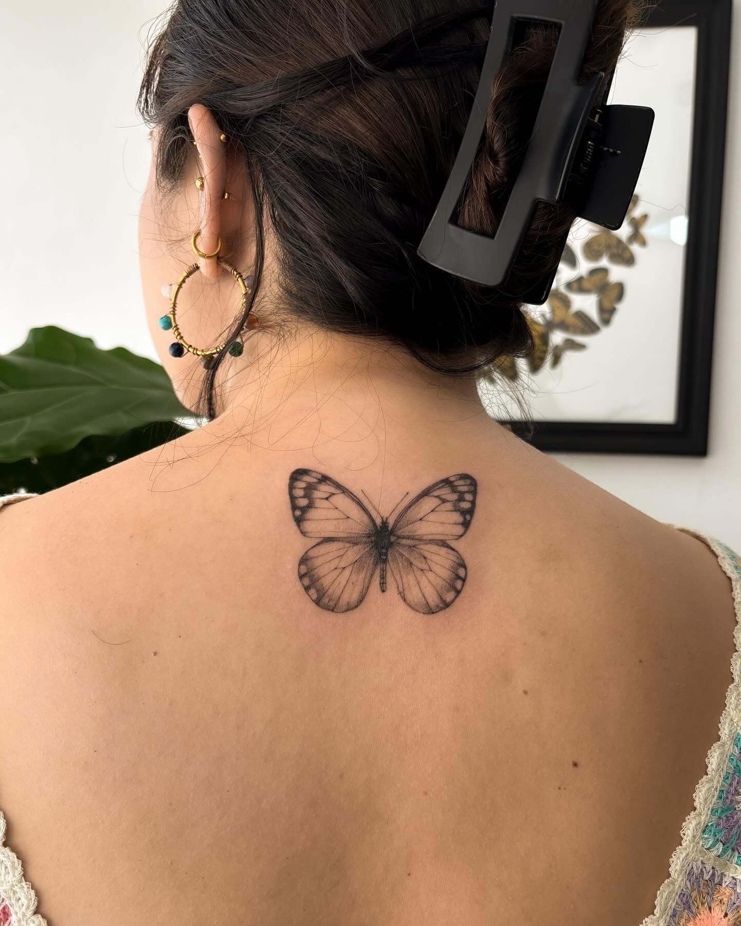 Graceful upper back butterfly tattoo with shaded wing gradients