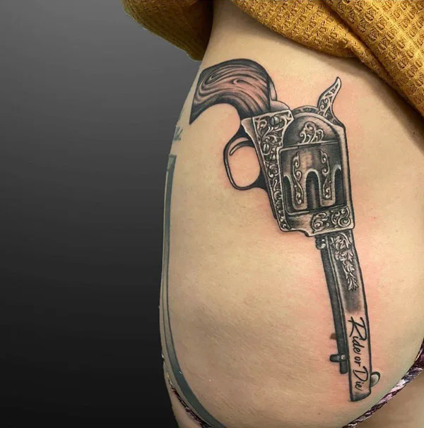 Gun butt tattoo