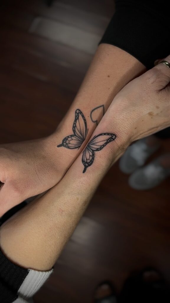 Half-Butterfly Mother Daughter Tattoos Representing Transformation and Unity