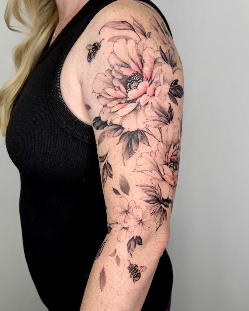 Half sleeve peonies with bees and a cute little ladybug blossoms and a tiny friend