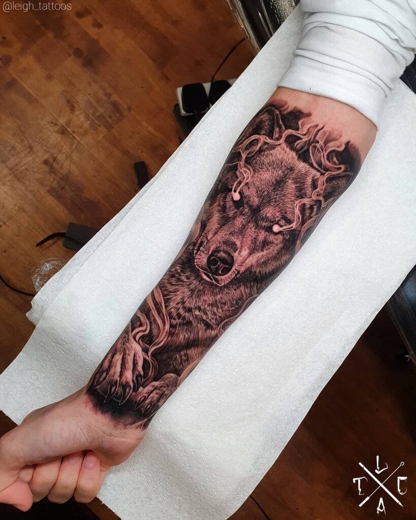 Half sleeve tattoo ideas for men angry wolf roaring in ink