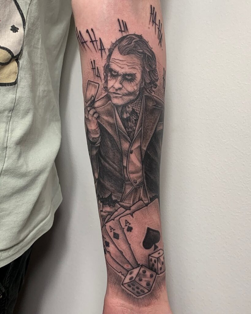 Half Sleeve Tattoo Joker Card Tattoo: Card-Holding Joker Ink Art