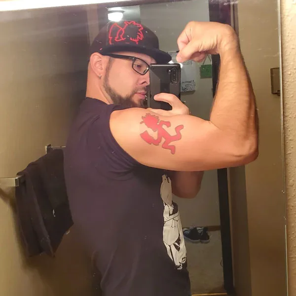 Hatchet man tattoo on bicep