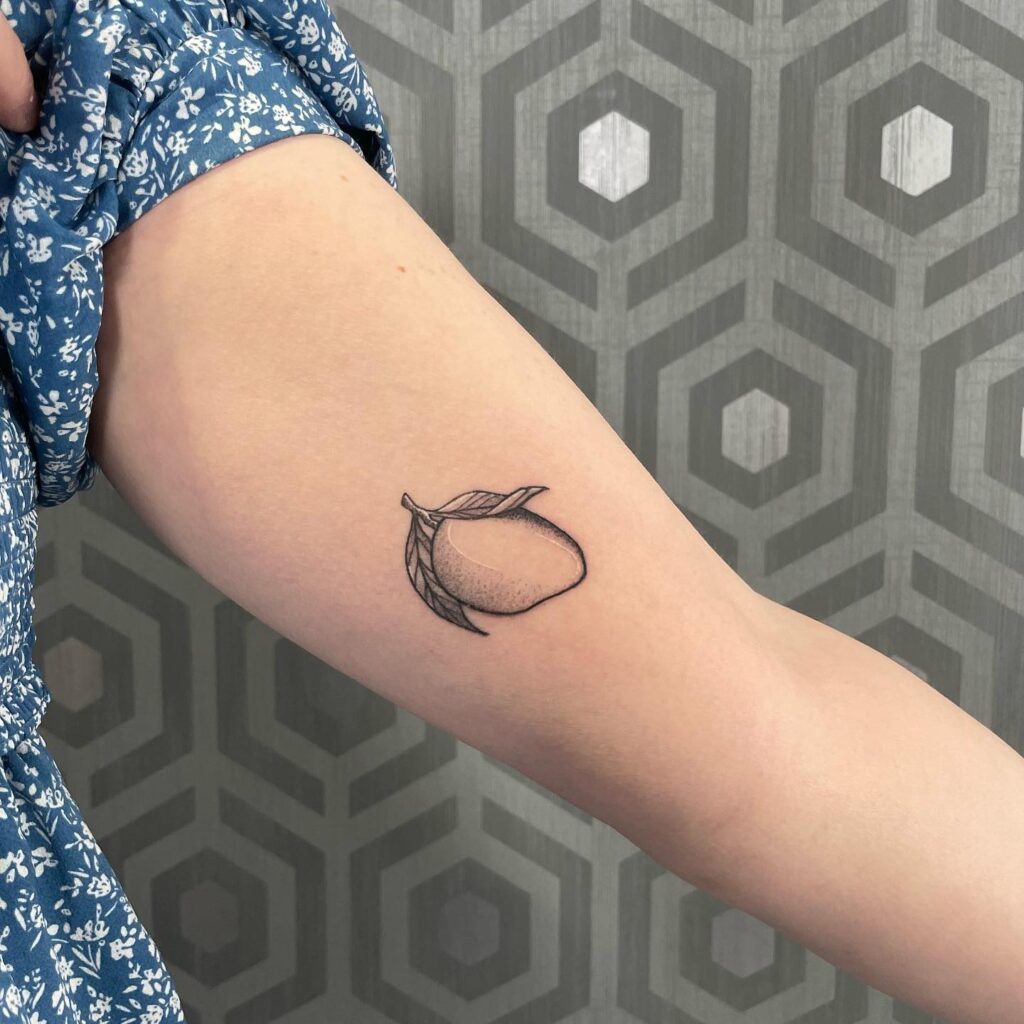 Healed Mango Tattoo on the Inner Arm in Elegant Black and Grey: Mango Magic