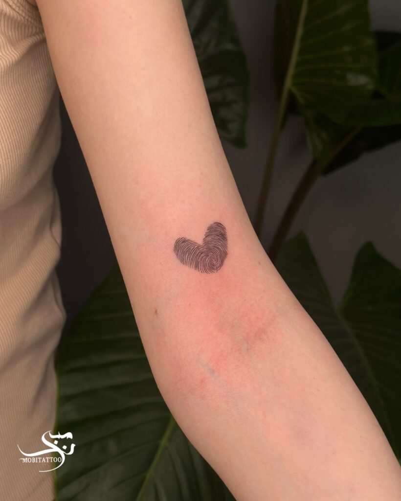 Heart Fingerprint Tattoo Above the Elbow: Heartfelt Identity