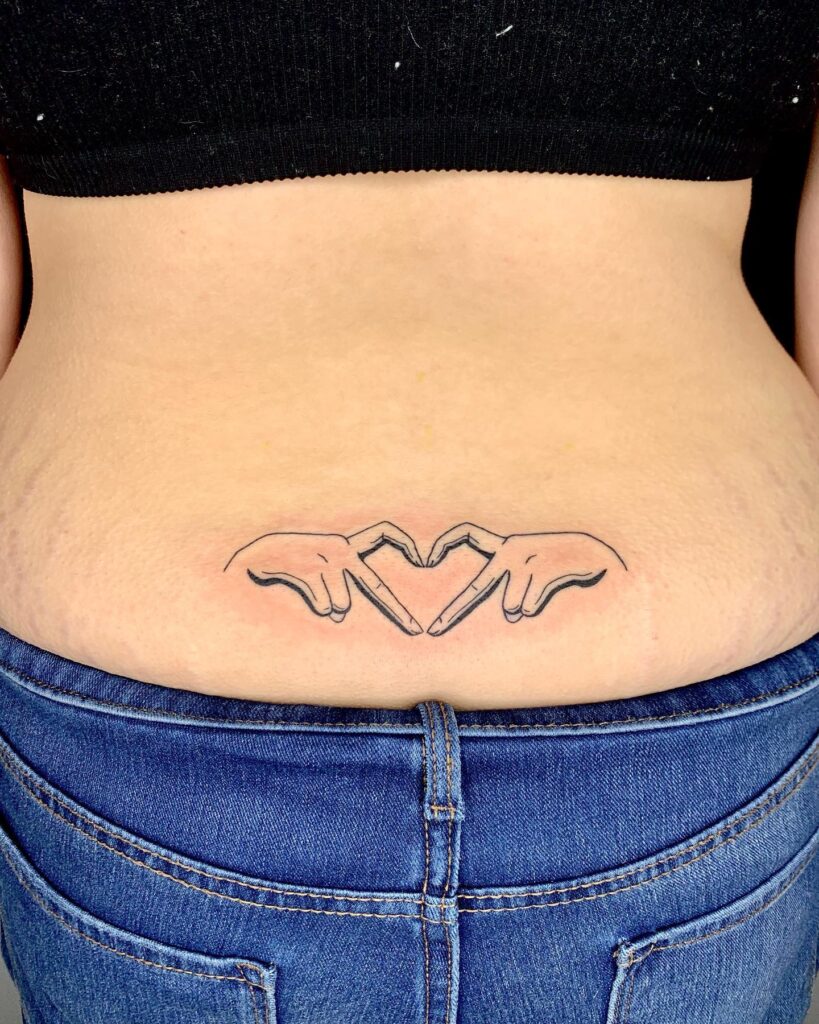 Heart Hands Symbol Tattoo, a Gesture of Love on the Lower Back: Harmony Embrace