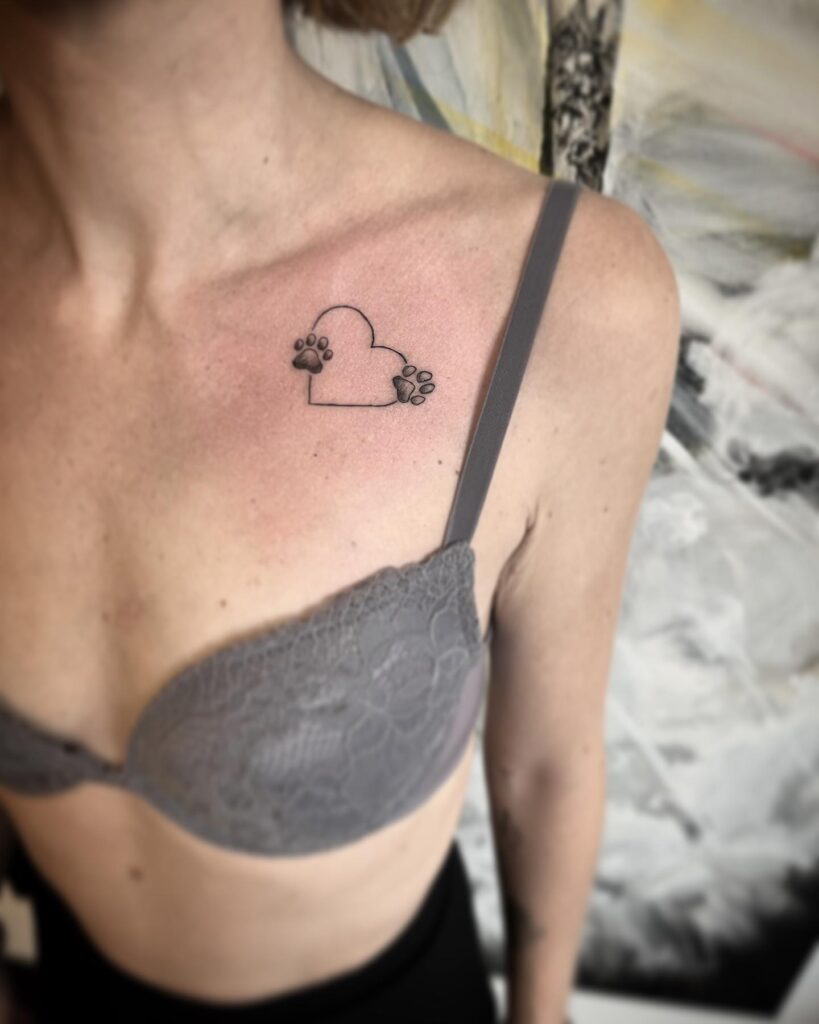 Heart Outline with Two Dog Paw Prints on the Collarbone: Heartfelt Connection