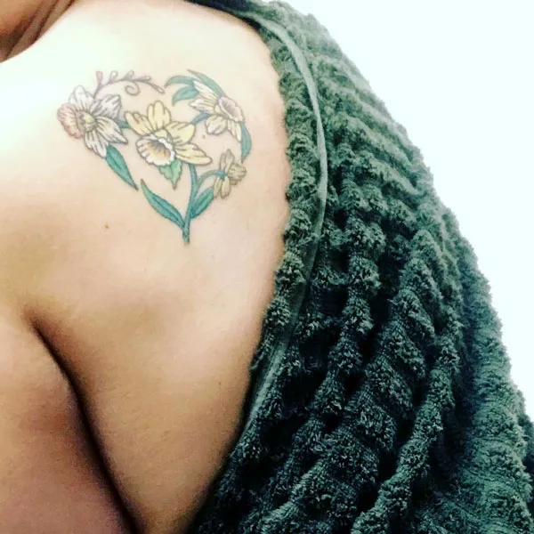 Heart shape December birth flower tattoo