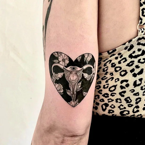 Heart shaped womb tattoo
