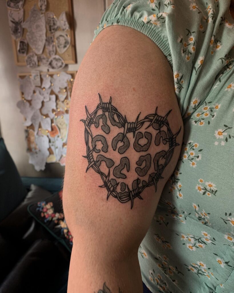 Heartfelt whimsy delicate leopard print heart tattoo