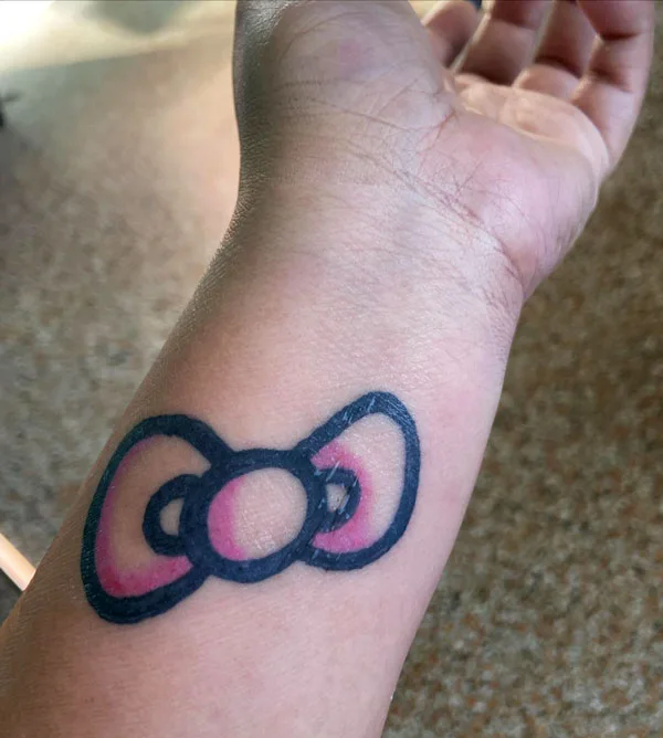 Hello kitty bow tattoo