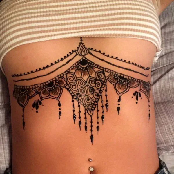 Henna under breast tattoo