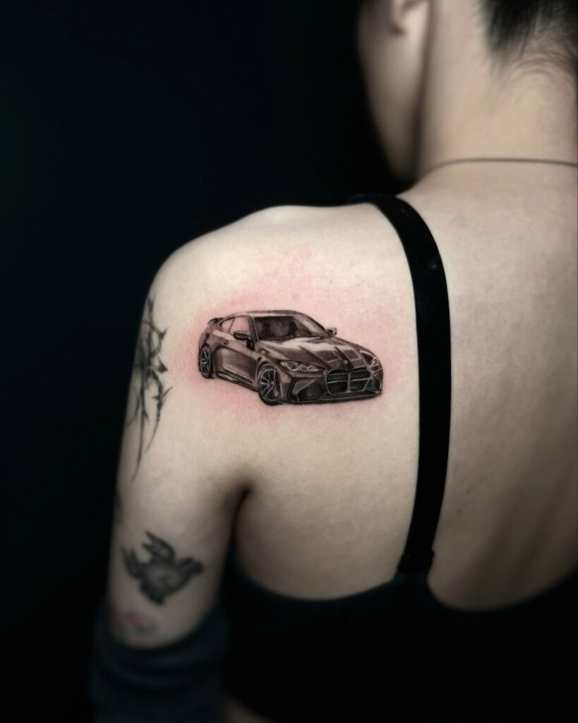 Highly Detailed BMW Front View Tattoo with Deep Shading on Shoulder – Car Tattoo Ideas
