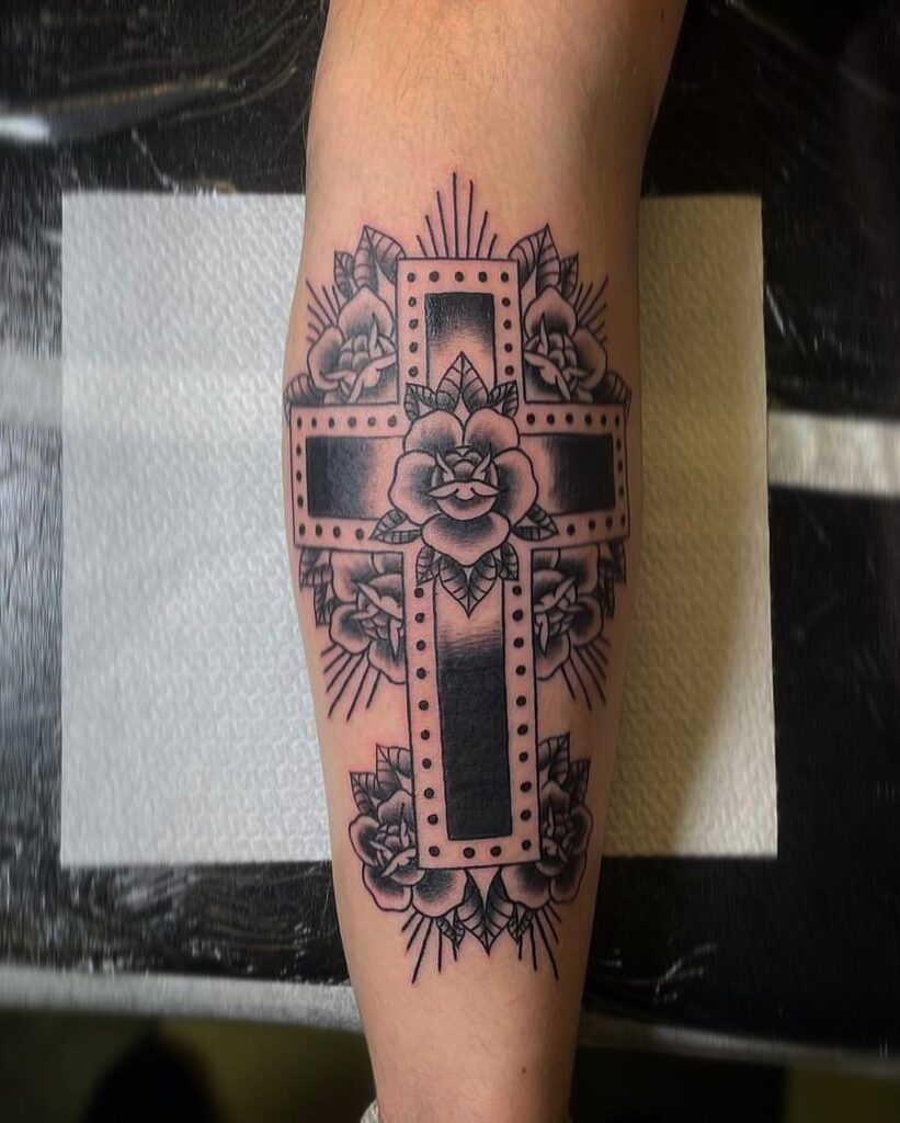 Holy cross and roses tattoo on forearm for men