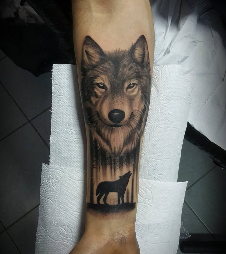 Howling wolf tattoo on forearm the call of the wild
