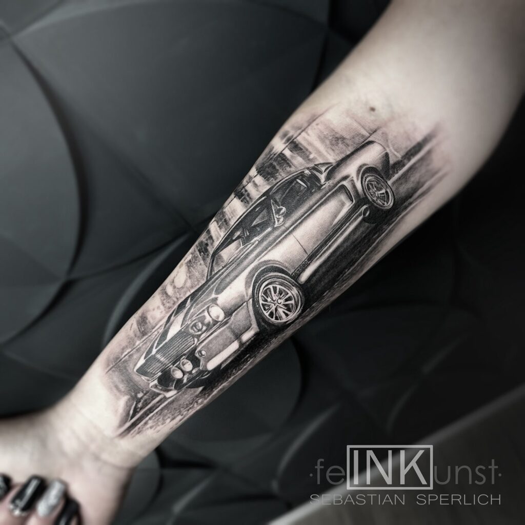 Hyper-Realistic Black and Gray Ford Mustang GT 500 Tattoo on Forearm for Female – Car Tattoo Ideas