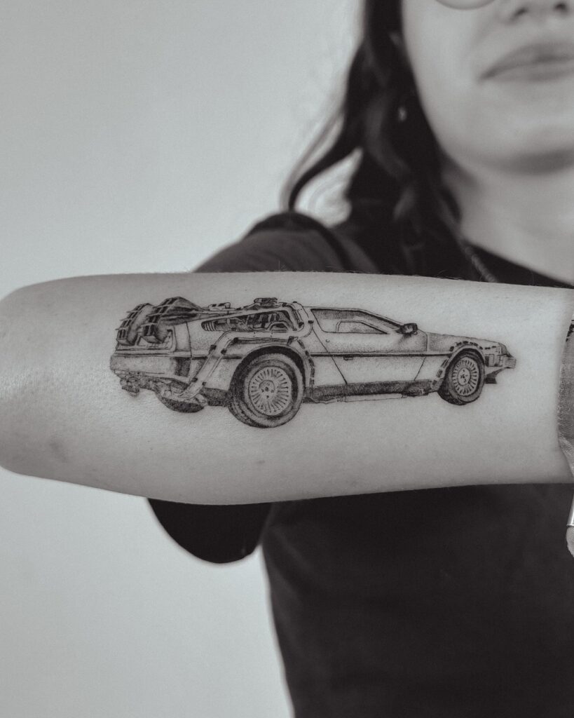 Iconic DeLorean DMC-12 Tattoo from Back to the Future on Arm with Time-Travel Elements – Car Tattoo Ideas