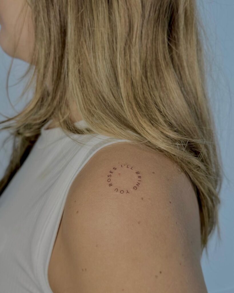 'i’ll bring you roses' Circle Text Tattoo on the Shoulder, an Artful Promise: Musical Roses