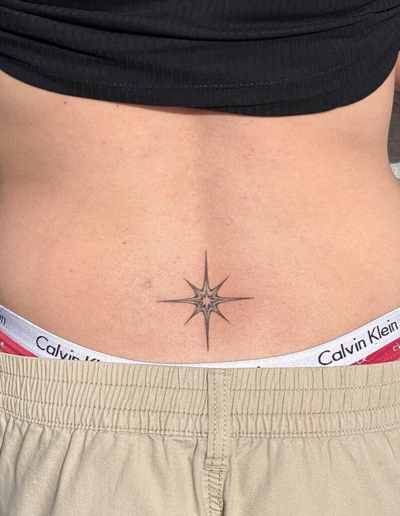 Illustrative North Star Tattoo on the Lower Back: Guiding Light