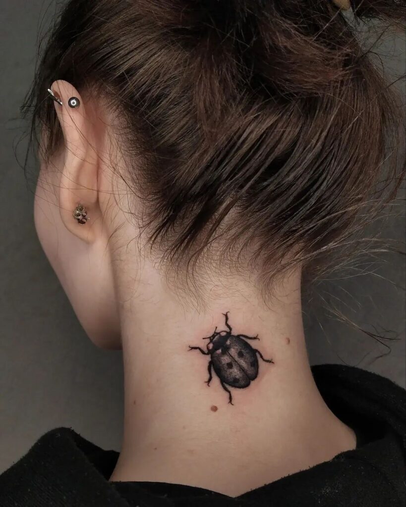 Impressive Ladybug Tattoo on Back of Neck Striking and Bold Ideas