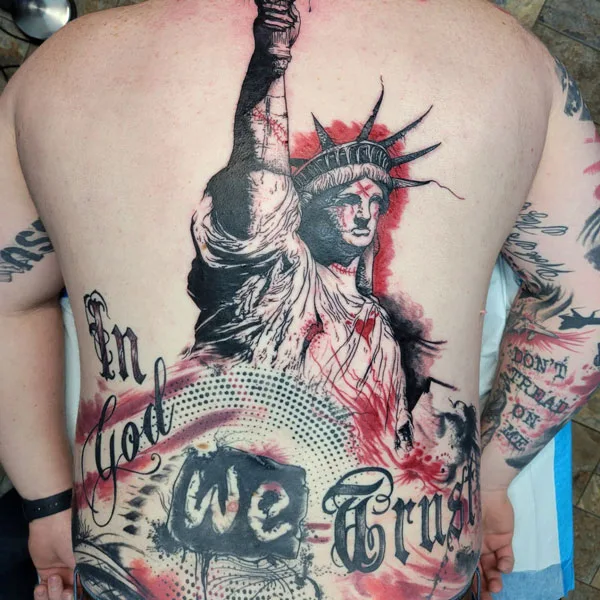 In god we trust back tattoo