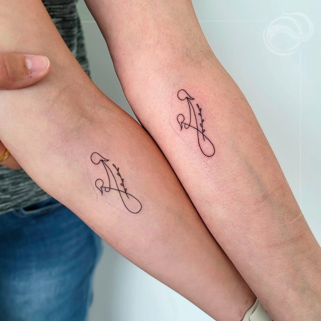 Infinity and Floral Mother Daughter Tattoos Symbolizing Eternal Love