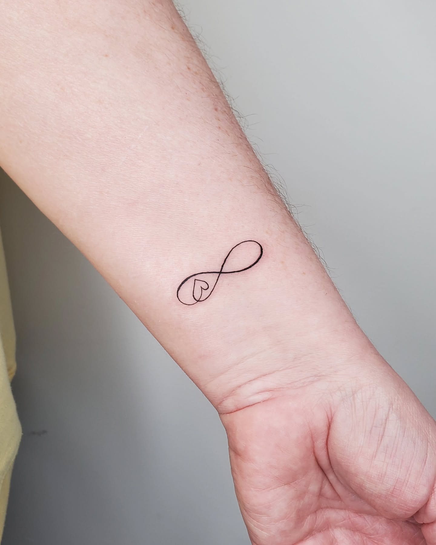 Infinity Heart Wrist Tattoo Minimalist Design Symbolizing Eternal Love and Friendship