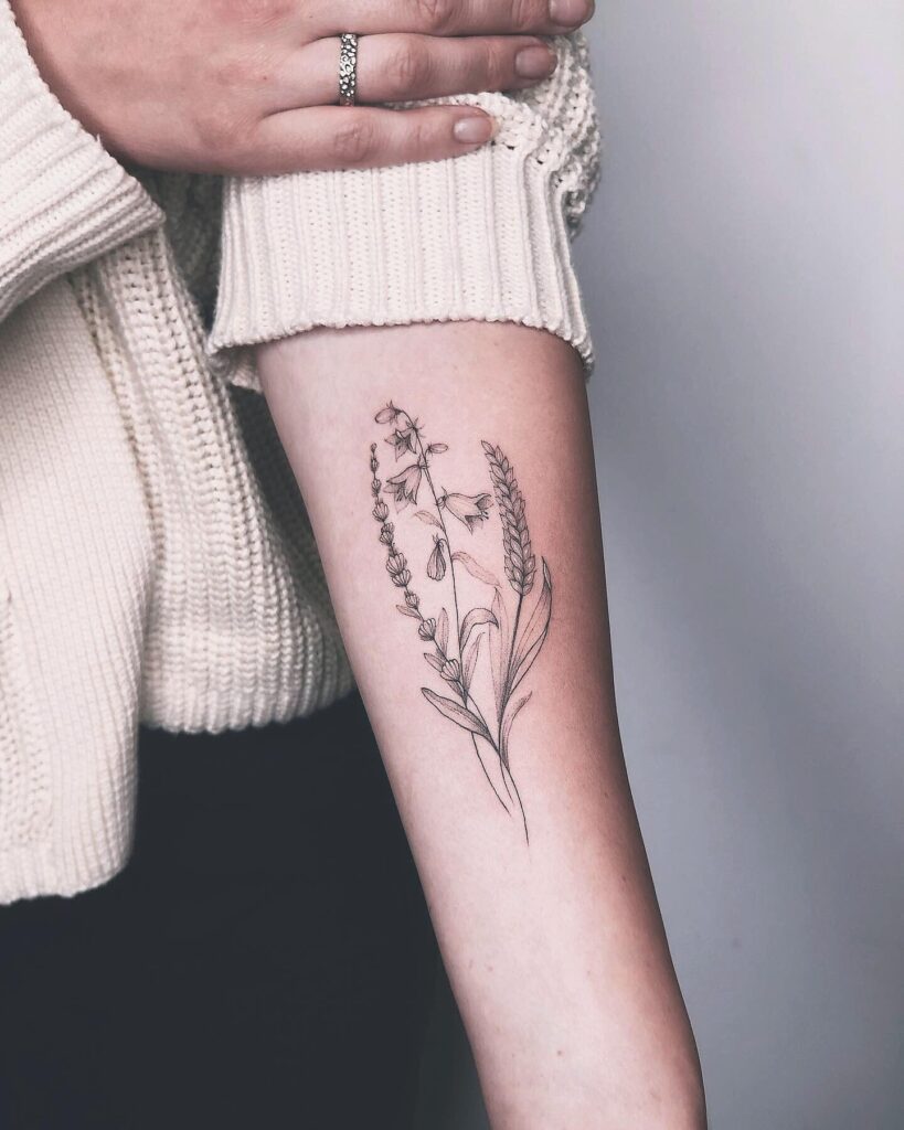 Inner forearm bluebell tattoo ideas for females artistic floral designs