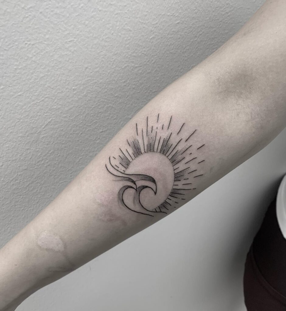 Inner forearm sun and wave tattoo simple elegance
