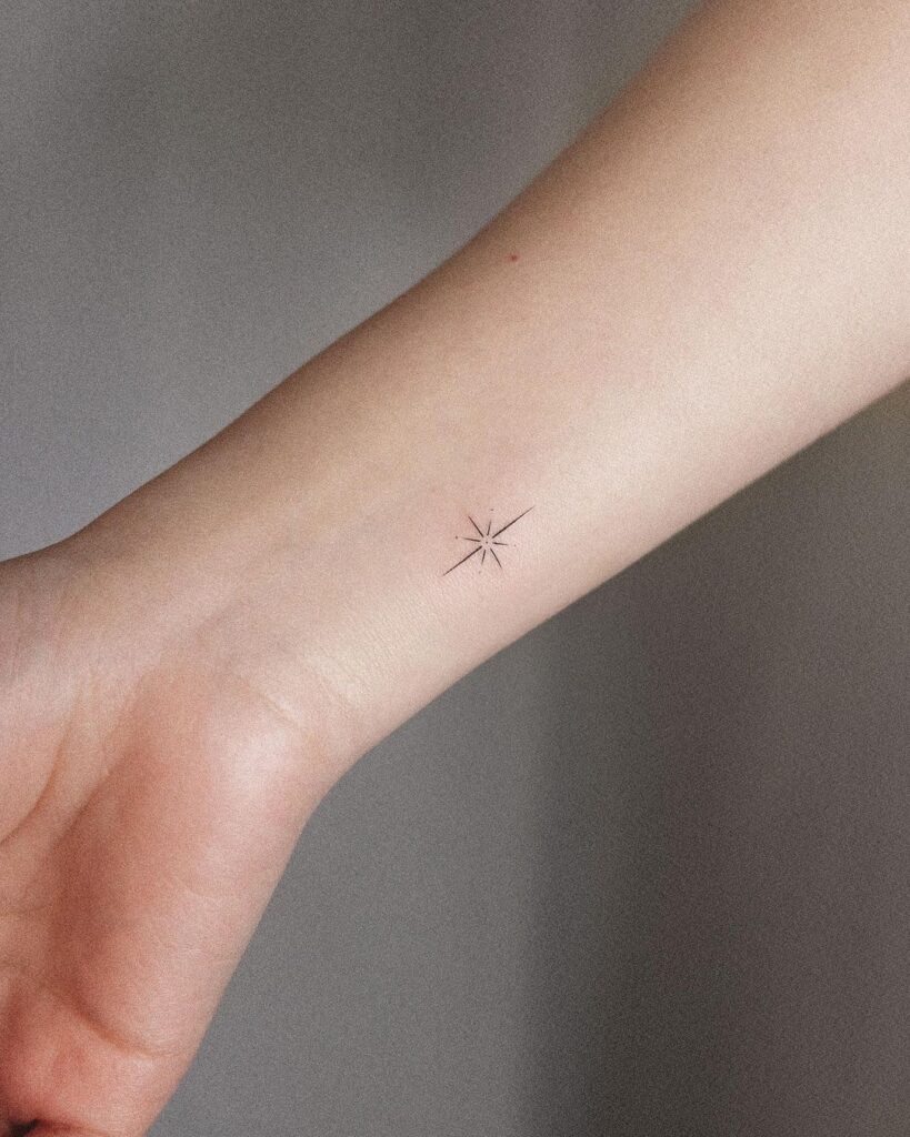 Inner tiny star ornament wrist tattoo delicate celestial ink