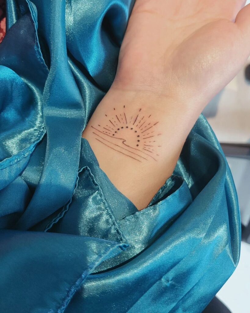 Inner wave and sun wrist meaningful tattoos for girls subtle and expressive designs