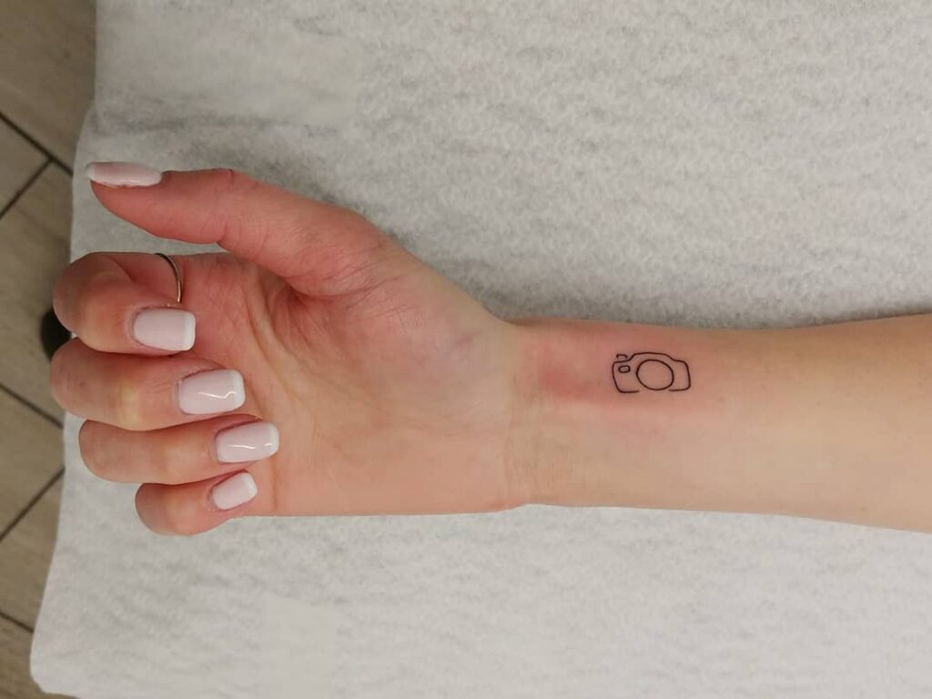 Inner wrist camera icon small outline tattoo for girls