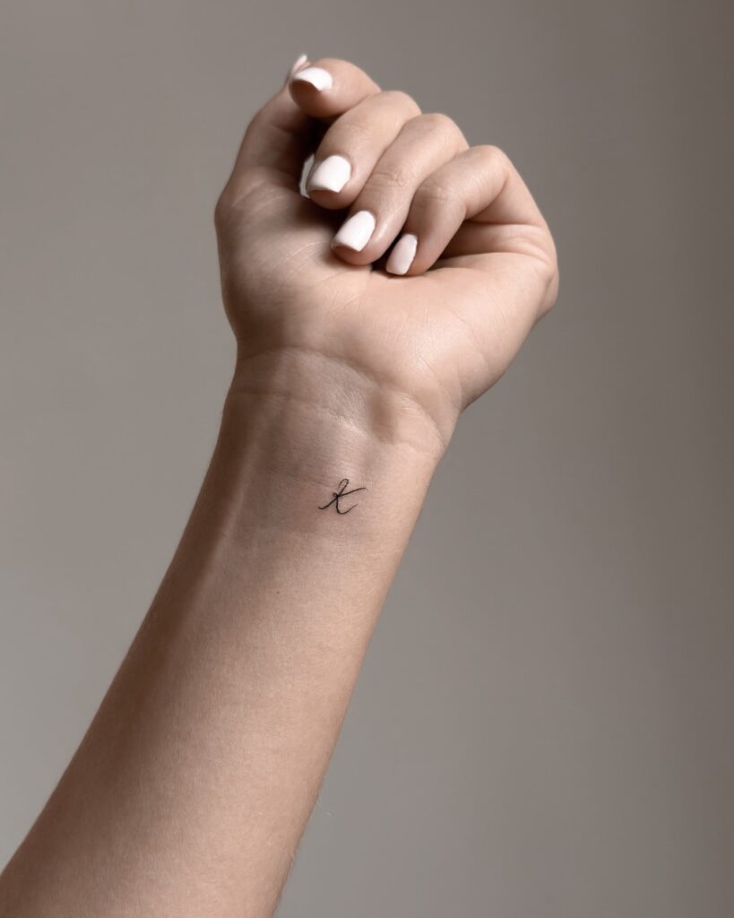 Inner Wrist Fineline 'K' Letter Tattoo: Stylish Statement