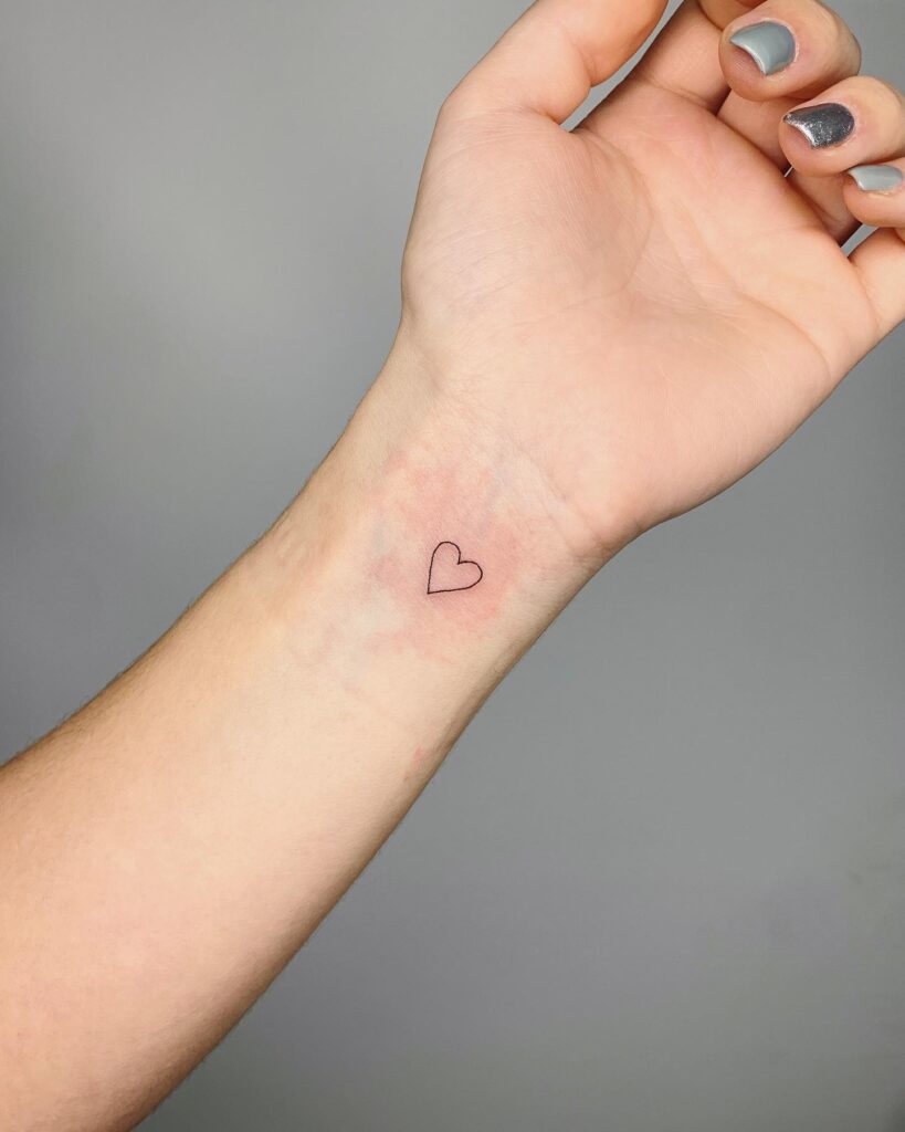 Inner wrist small purple heart tattoo subtle and stylish
