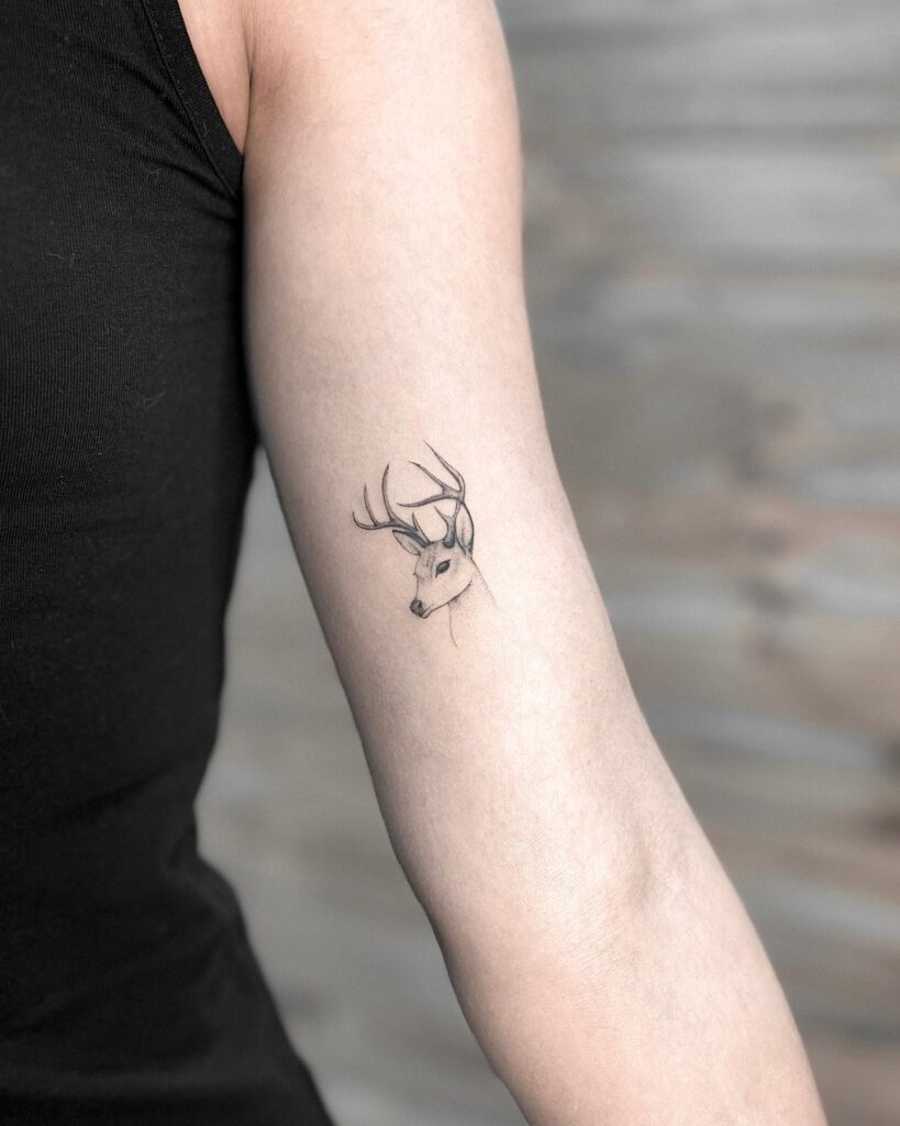 Intricate Deer Head Tattoo on the Inner Arm: Micro Realism