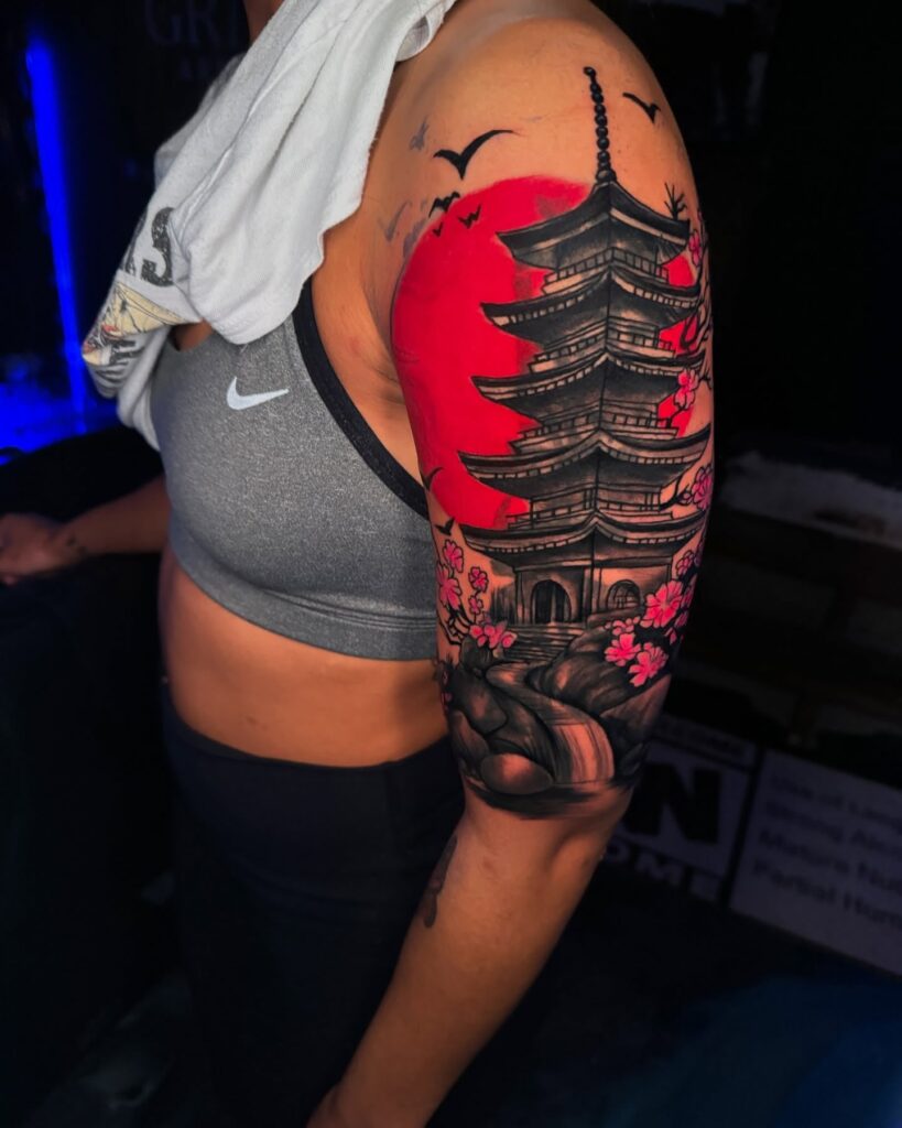 Japanese pagoda tattoo sleeve with cherry blossoms and setting sun