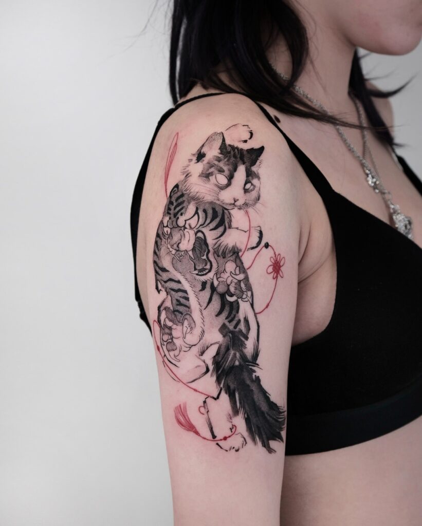 Japanese-style mystical cat tattoo with red string and cloud motifs