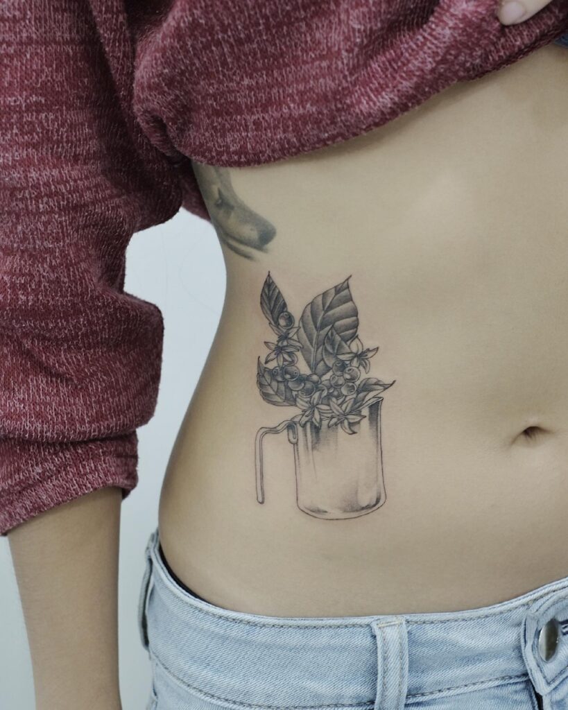 Java vibes coffee plant and barista pitcher tattoo on side stomach