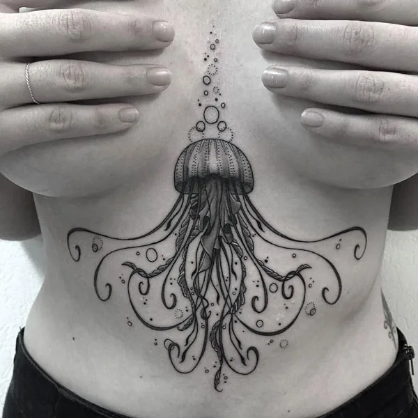 Jelly fish under boob tattoo