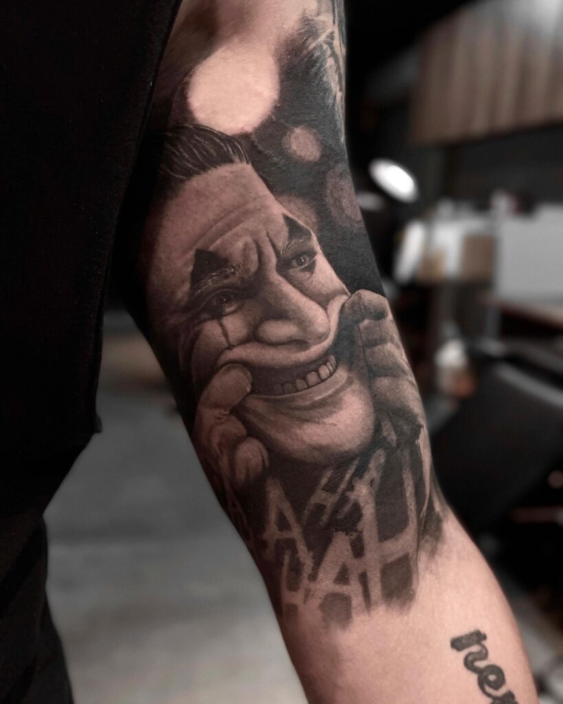 Joker Smile Hand Tattoo in Black and White