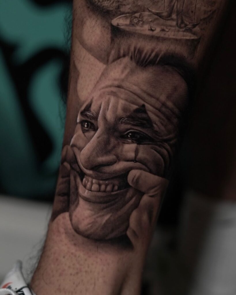 Joker Cry and Smile Tattoo on Leg: Emotional and Dramatic Leg Tattoo