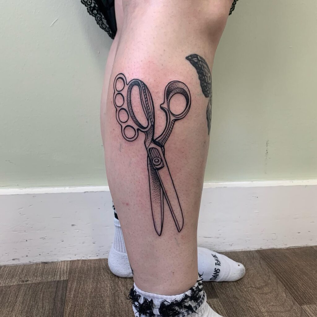 Knuckle Duster Scissors Tattoo Illustration, a Unique Weapon Tattoo on the Leg: Cutting Edge